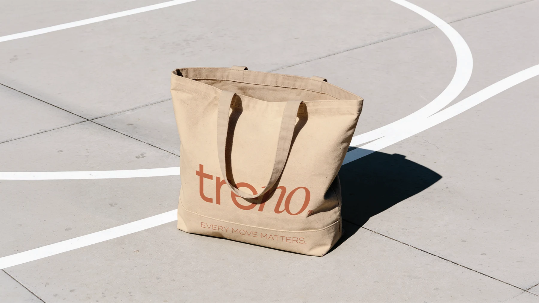Treno branded tote bag on a sports court